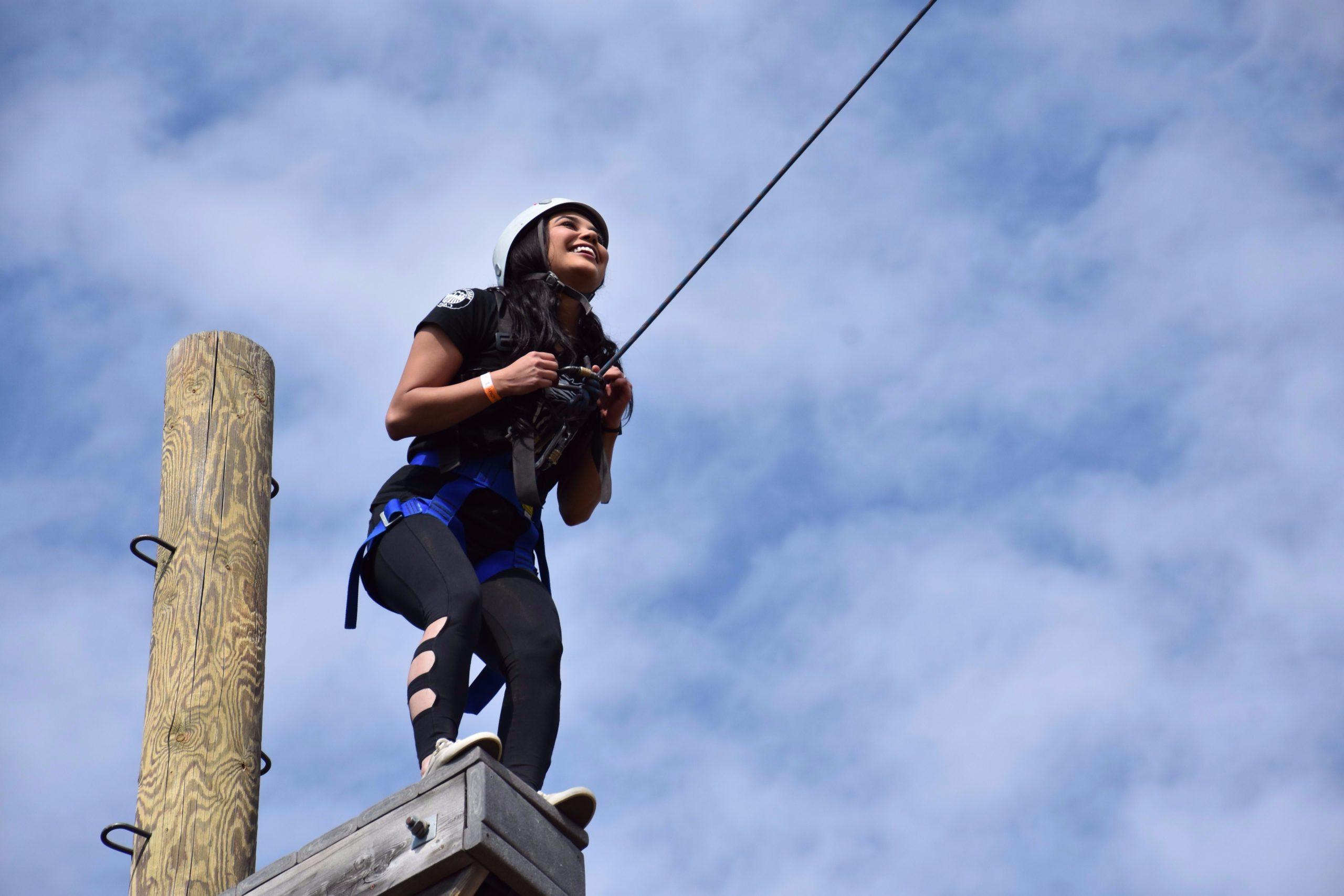 CAMP student at ropes course