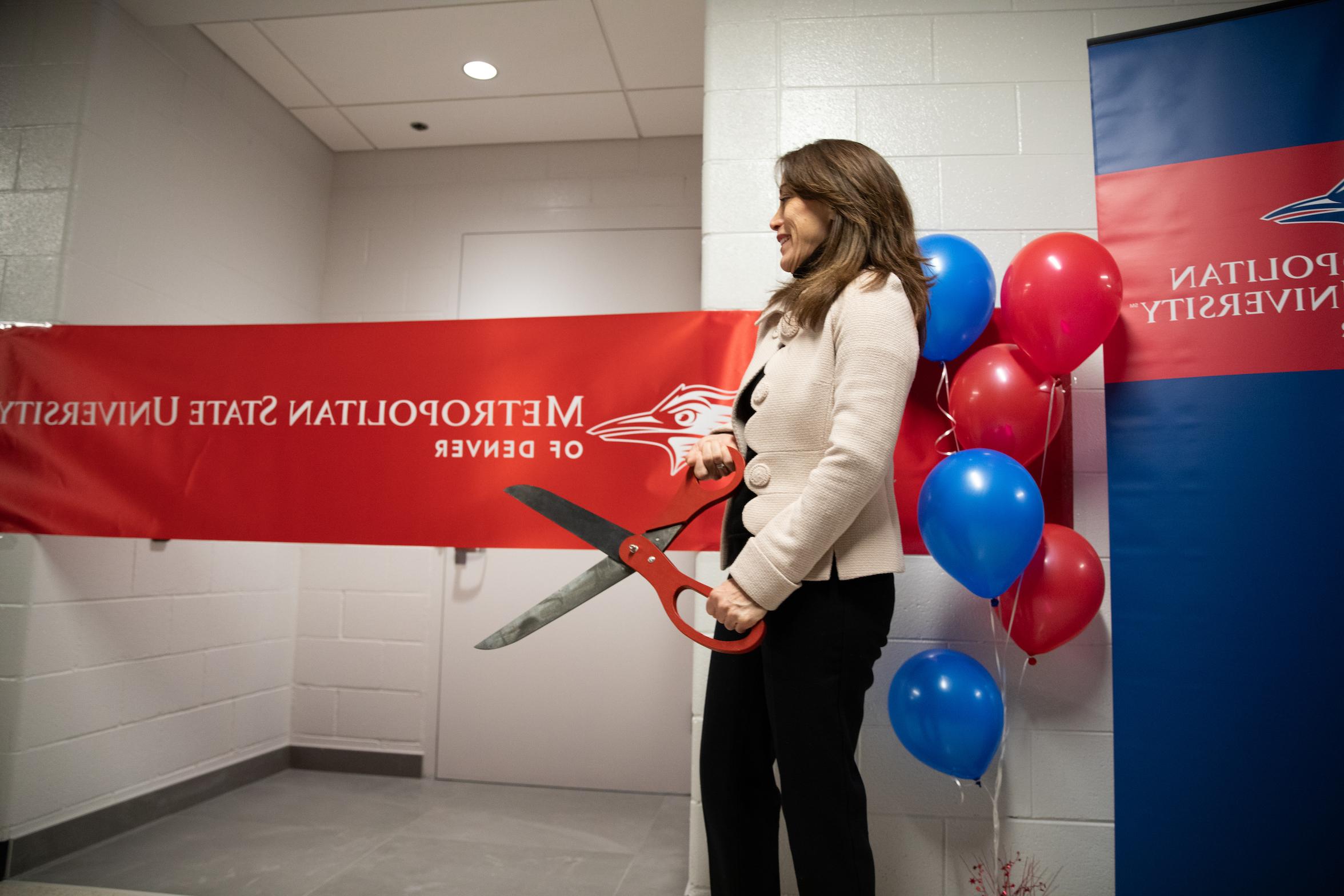 Dr. Davidson about to cut the ribbon