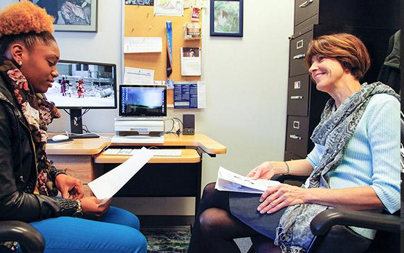 Ann Williams with a student in a counseling session