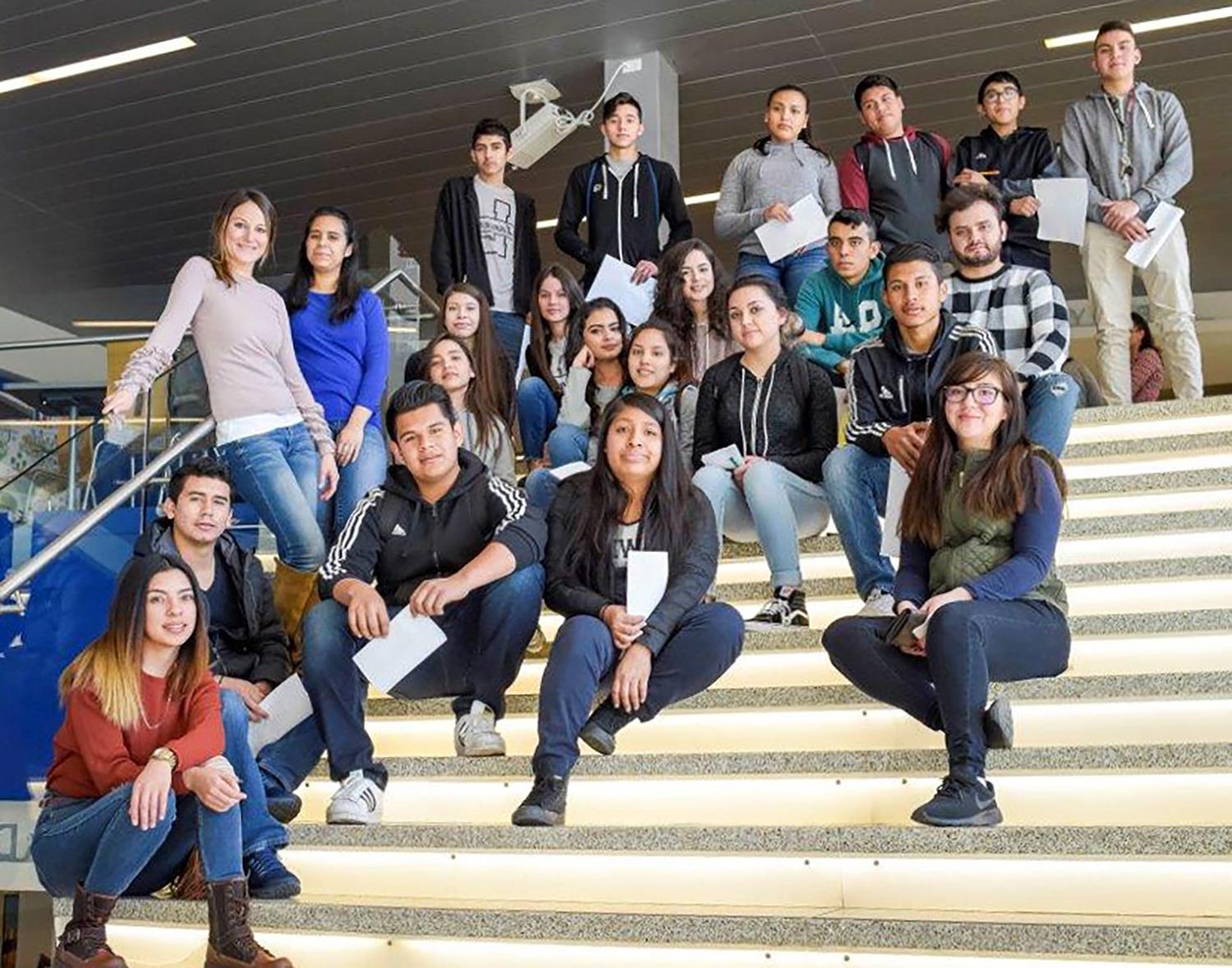 Group of high school students sitting on stairs