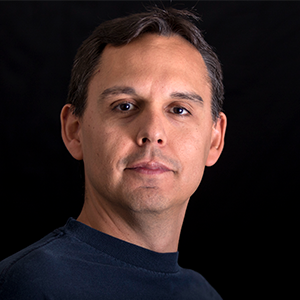 Profile image of Dr. Jovan Hernandez, Professor. Solid black background.